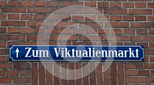 Street sign Viktualienmarkt on brick wall photo