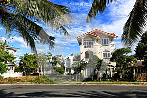 villa in a palm grove, white house, red roof, palm trees, Vietnam