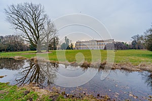 Villa Reale building, lawn, trees, and water stream, Monza Park