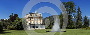 Villa Taranto with a fountain in front, located on the shore of Lake Maggiore in Pallanza, Verbania, Italy photo