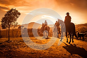 Villafranca del Bierzo, Spain - Three People Horse Riding into the Sunset photo