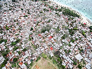 Village on african island with rows of poor houses, top view