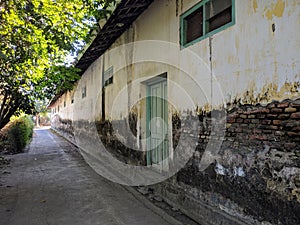 Village Alley. Old grunge street. Grungy urban background