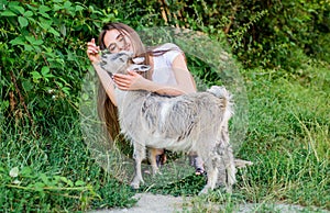 Village animals. Girl play cute goat. Feeding animal. Protect animals. Veterinarian occupation. Eco farm. Love and care