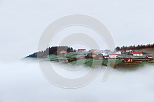 Village in Aramaio valley surrounding by fog