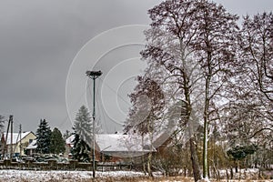 Village awaiting the return of a stork