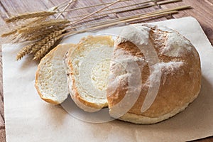 village bread with koes on paper on table