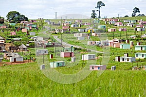 A village of brightly colored Mandela Houses in Zulu Village, Zululand, South Africa photo