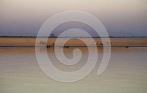 Village camp along the Irrawaddy during sunset