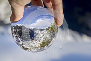 Village of Canillo reflection view through crystal ball, in Roc Del Quer. Andorra. photo