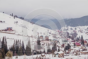 Village in the Carpathian mountains in Eastern Europe. Rustic winter landscape