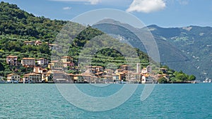 The village of Carzano from the boat. Village located on the Island of Montisola. Lake Iseo. North Italy. Tourists destination photo