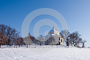 Village chapel in winter countryside photo