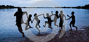 Village children swimming on Acajatuba lake