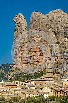 Village with church bellfry and Aguero Mountains, Huesca, Spain