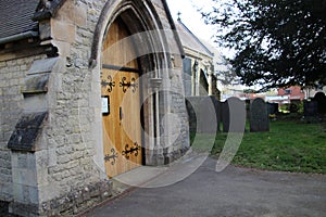 Village church door and grave yard