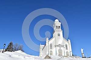 The village church under a blue sky