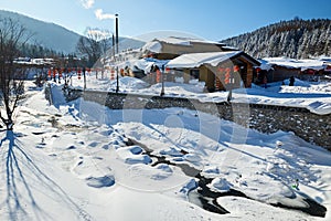 The village covered with snow in the China`s snow town