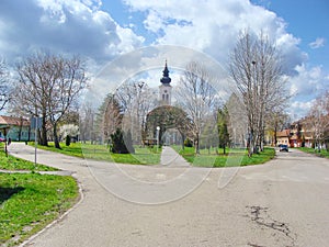 Village Debeljaca, Vojvodina, Serbia. Center of the village with park and church tower.