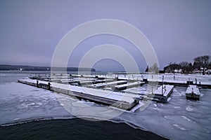 Village dock and pier in winter Ephraim wisconsin door county peninsula in partially frozen eagle harbor
