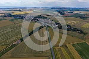 Village from drone aerial view. Beautiful village with houses and fields in Nysa, Poland. Polish farmland