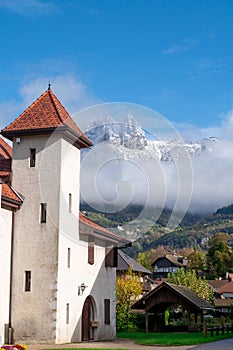 village of Duingt in the Alps, snow-capped mountain in background
