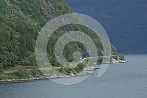 The village of Eidfjord in Norway is a major cruise ship port of call. It is situated at the end of the Eid Fjord, an inner branch