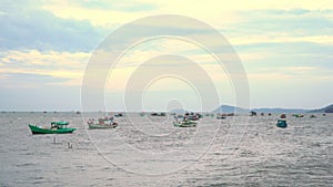 Village of fishermen. Pier with fishing boats at a pier. Boats stand at a pier against the background of a decline