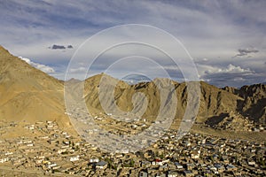 A village at the foot of the mountain sand desert