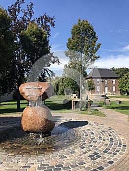 Village fountain at Quirinusplatz in Millingen