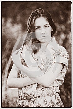 The village girl in a scarf. Post processing in the style of vintage. Noises photo