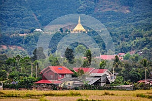 Village and golden stupa in Luang Nam Tha, Laos