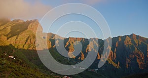 Village and Gorge Maska is illuminated by the setting sun. Colourful sunset time in Masca. Tenerife, Canary islands