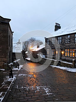 The village of heptonstall in the snow at night