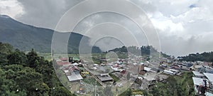 village in the highlands covered in cloud