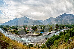 Village in Kullu Valley, Beas river foreground