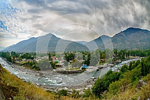 Village in Kullu Valley, Beas river foreground