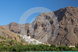 The village of La calera is embedded between mountains in the valley of Gran Rey photo