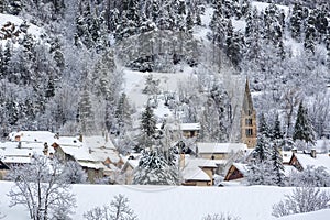 Village of La-Salle-les-Alpes with fresh snow in winter. Serre Chevalier, Hautes-Alpes, France photo