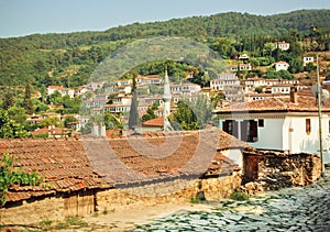 Village landscape with minaret and tiled roofs of Turkey