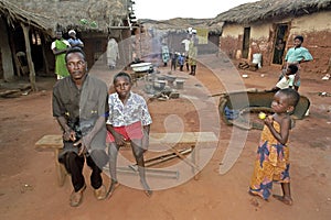 Village life in Ghana with women, father and son