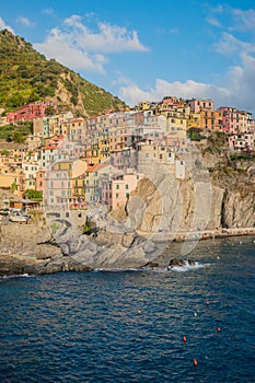 Village of Marola on the Mediterranean Sea with colorful houses on hill, ITALY