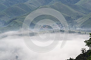 Village in the mist in the winter.