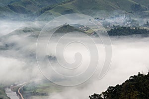 Village in the mist in the winter.