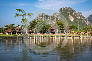 Village and mountain in Vang Vieng, Laos and Nam Song rive , Laos. Southeast Asia