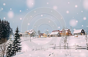 Village in the mountains in winter. Christmas card