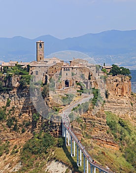 Village named Civita di Bagnoregio in Italy and the long bridge