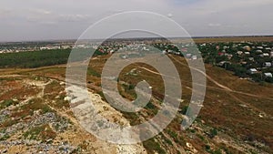 Village near a municipal landfill. bird`s-eye view.