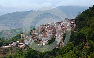 Village over terraced rice fields in Yuanyang, Yunnan, China