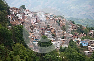 Village over terraced rice fields in Yuanyang, Yunnan, China